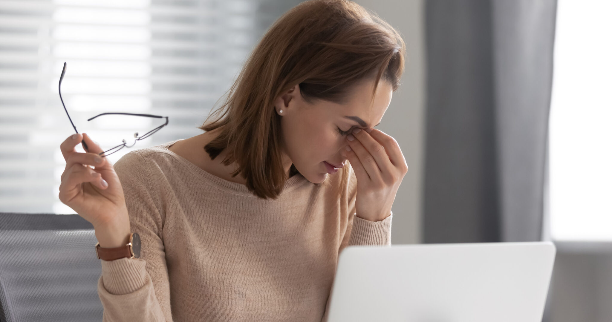 Office worker Rubbing her eye